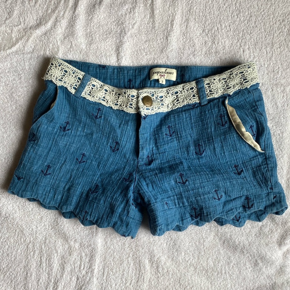 Jean shorts with lace detailing and scalloped hem